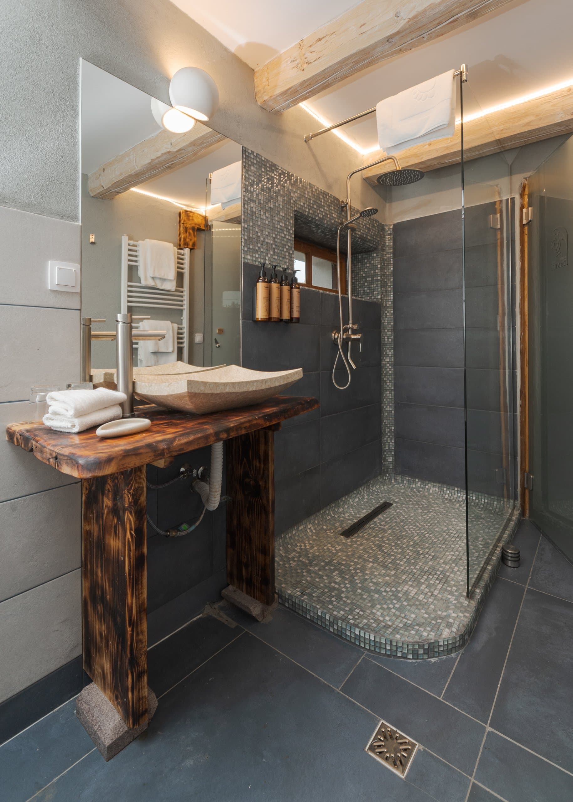 Luxury bathroom with wooden vanity and walk-in shower