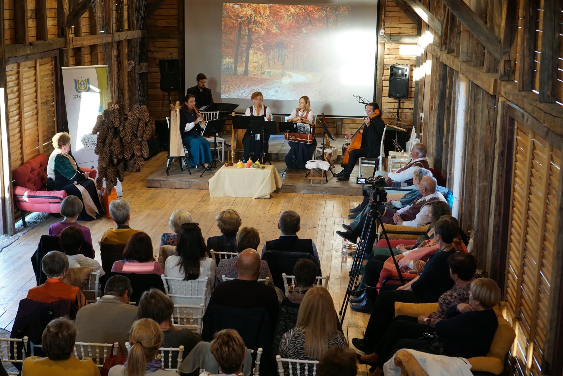 Renaissance Music Festival performance in the Event Barn with musicians and audience
